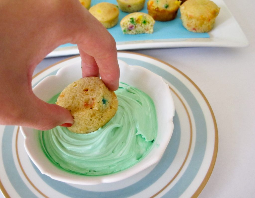 Let party guests decorate their own mini cupcakes. Using the recipe from our party guide, we baked these in mini muffin pans. Provide a bowl of frosting and plenty of sprinkles. Tipping the cupcake upside down, swirl in a bowl of frosting. Remove and dip in a bowl of sprinkles.