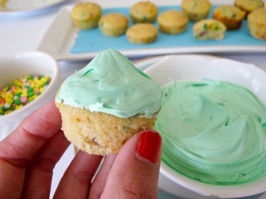 Let party guests decorate their own mini cupcakes. Using the recipe from our party guide, we baked these in mini muffin pans. Provide a bowl of frosting and plenty of sprinkles. Tipping the cupcake upside down, swirl in a bowl of frosting. Remove and dip in a bowl of sprinkles.