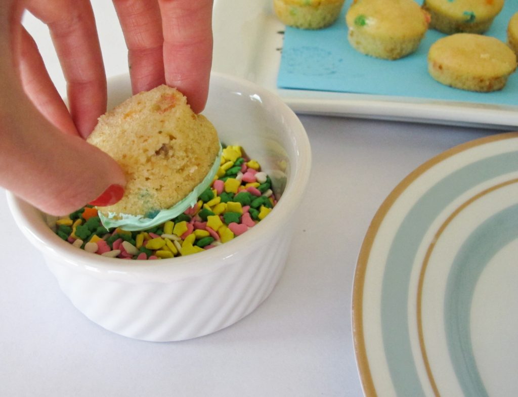 Let party guests decorate their own mini cupcakes. Using the recipe from our party guide, we baked these in mini muffin pans. Provide a bowl of frosting and plenty of sprinkles. Tipping the cupcake upside down, swirl in a bowl of frosting. Remove and dip in a bowl of sprinkles.