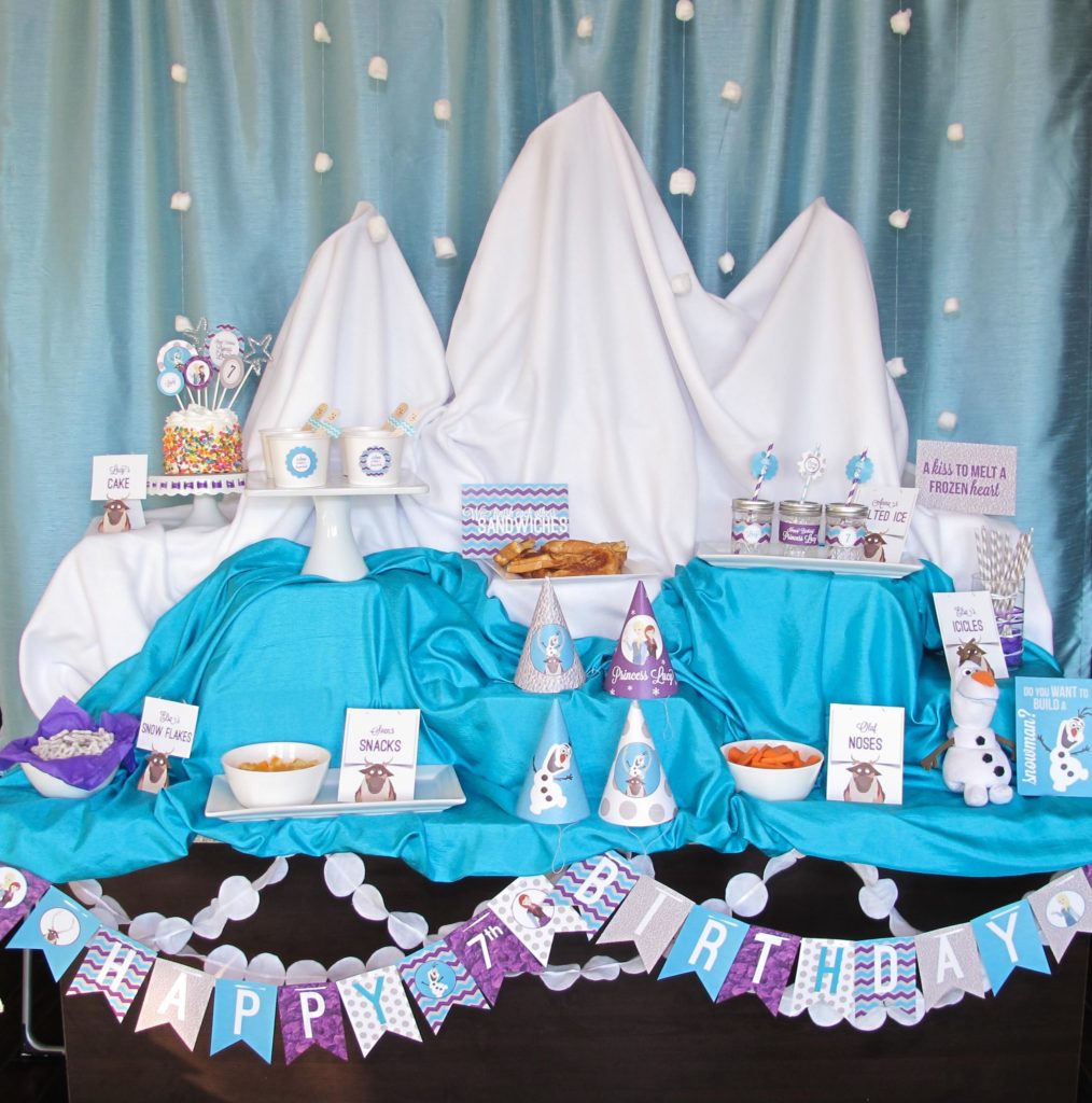Disney Frozen Party Ideas | This Winter Wonderland Frozen party was created on the center island in my kitchen using boxes, fabric, curtains, and a few cotton balls. The girls loved...