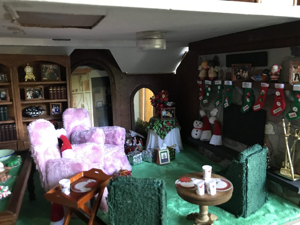 Dollhouse miniature family room at Christmas, fireplace with stockings
