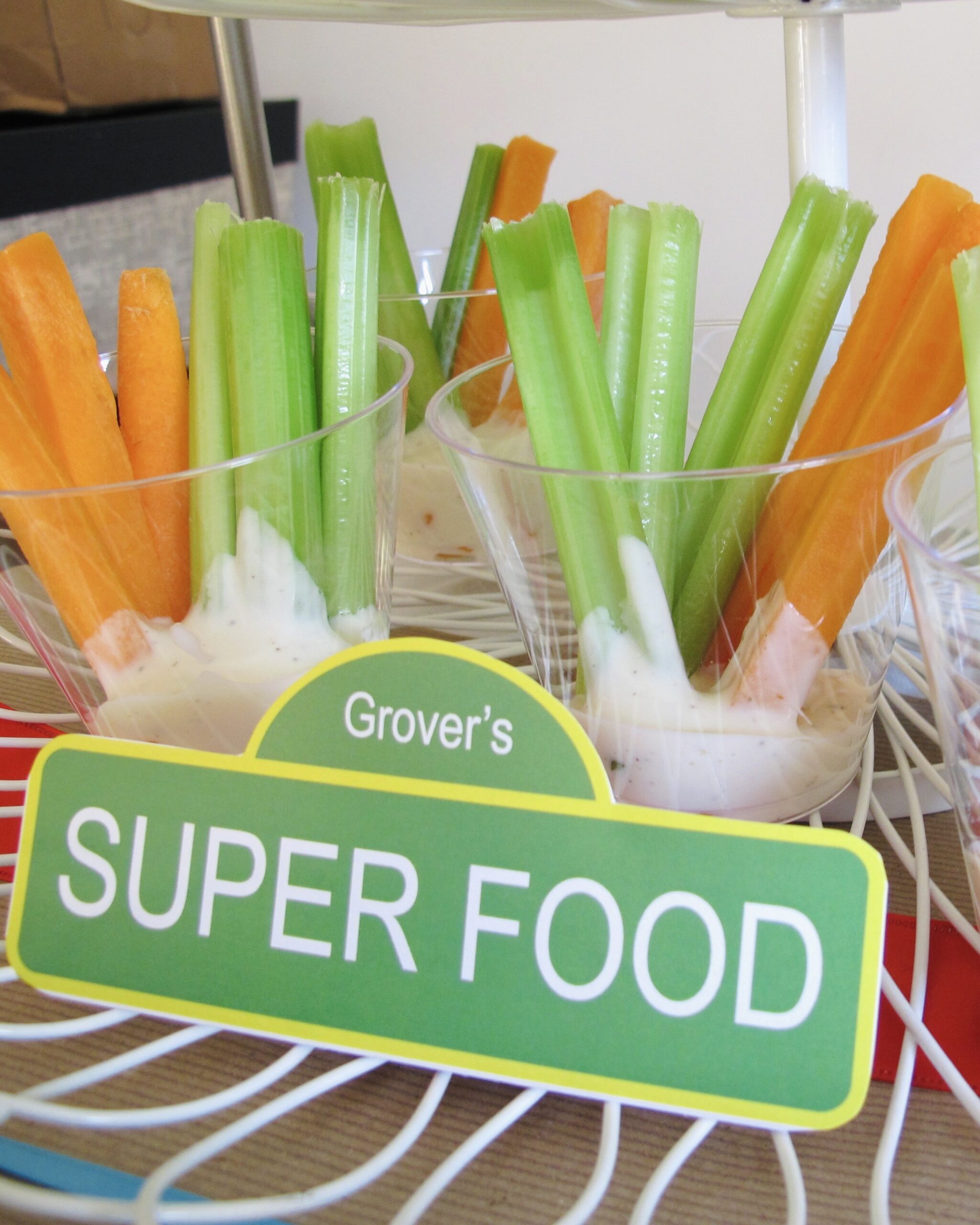 Grover’s Super Food veggie tray with fresh vegetables and kid-friendly dip cups