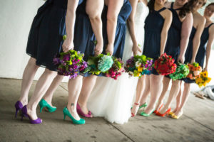 Minneapolis Real Wedding | Bridesmaids wore navy dresses from Target with different color shoes, all matching their bouquets. Red, salmon, yellow, kate spade green, teal, purple, and pink.